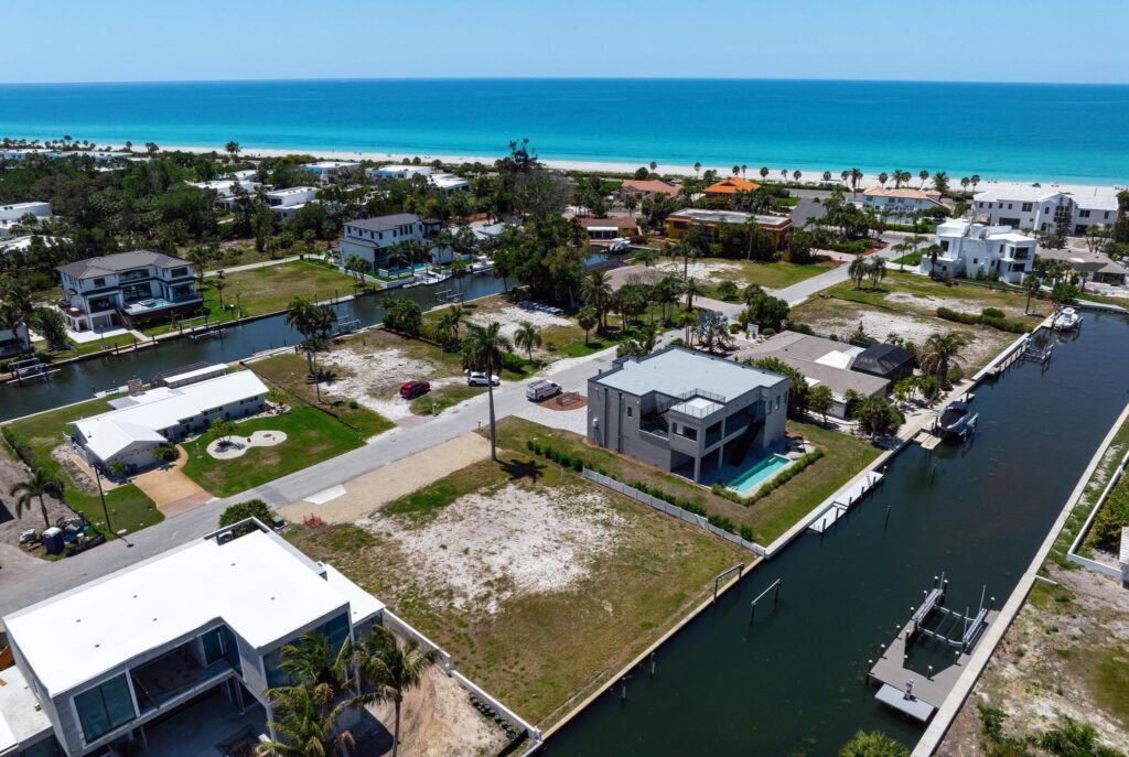 A coastal neighborhood with modern houses and a canal.